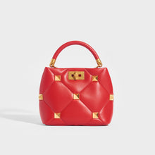 Load image into Gallery viewer, Front view of the VALENTINO Garavani Roman Stud Small Quilted Leather Tote in Red with Top Handle and Shoulder Strap 