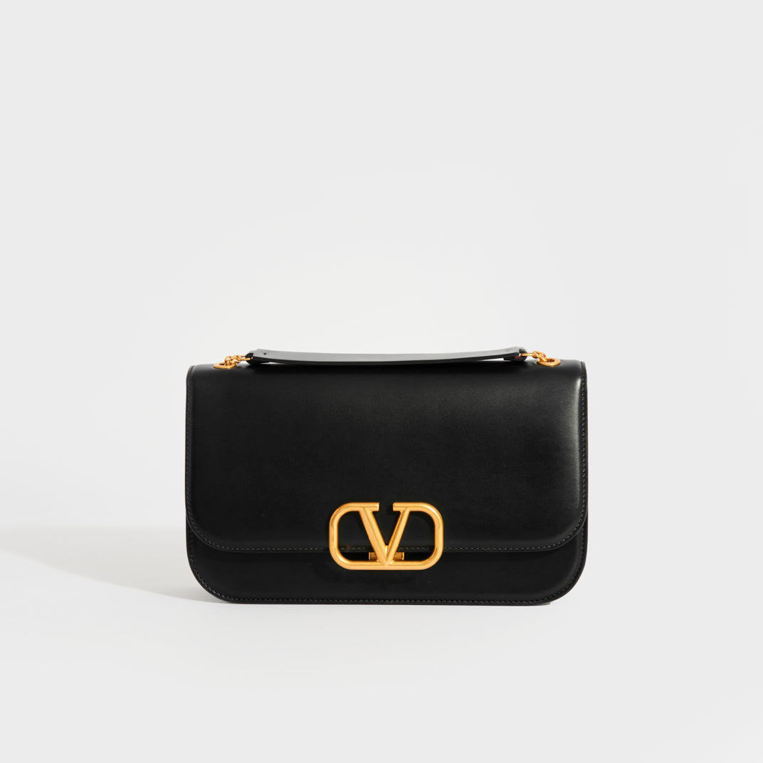 VALENTINO Garavani Sling Leather Chain Bag in Black COCOON
